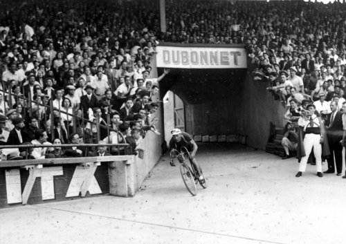 Cycling, 1935 Tour de France, 27th stage Caen-Paris. Being watched by a huge audience, Belgian Romain Maes, stagewinner and overall winner, enters the Parc des Princes stadium. Paris, 28 July 1935.